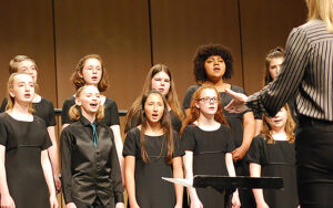 young people singing in a choir